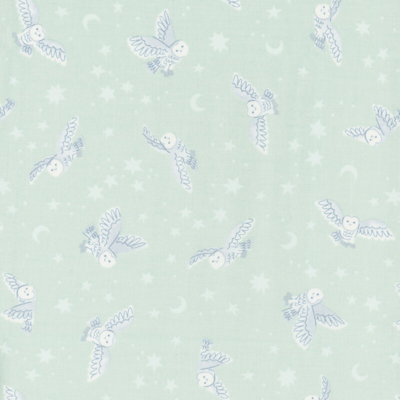 mint green fabric featuring owls, star, and moons