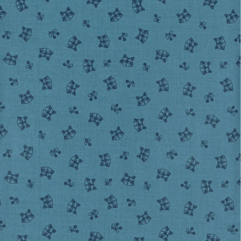 blue fabric featuring tossed raccoon heads and sprigs