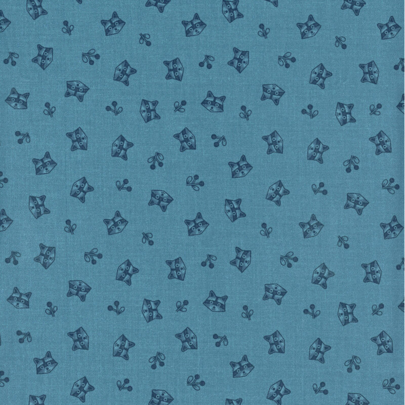blue fabric featuring tossed raccoon heads and sprigs