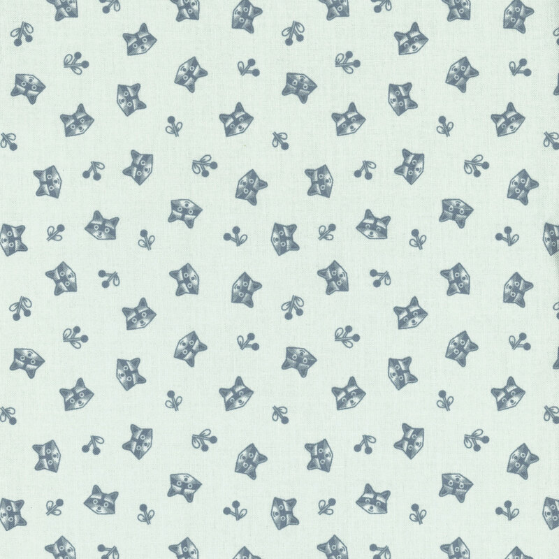 light aqua fabric featuring tossed raccoon heads and sprigs