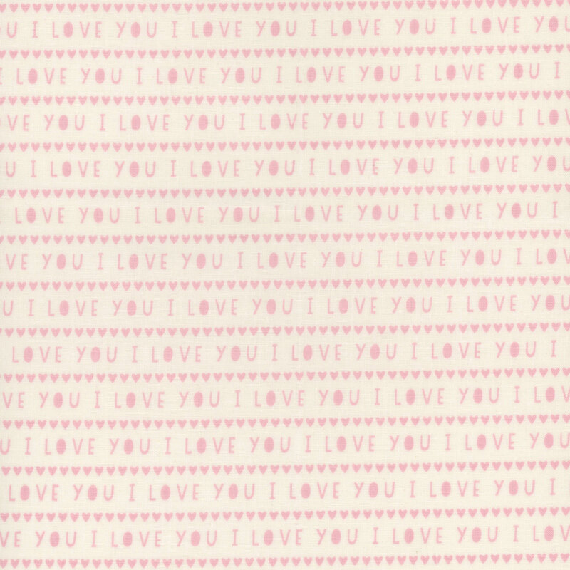 White fabric with small, light pink rows of hearts and the words 