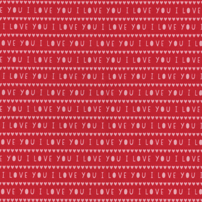 Bright red fabric with tiny rows of white hearts and the words 