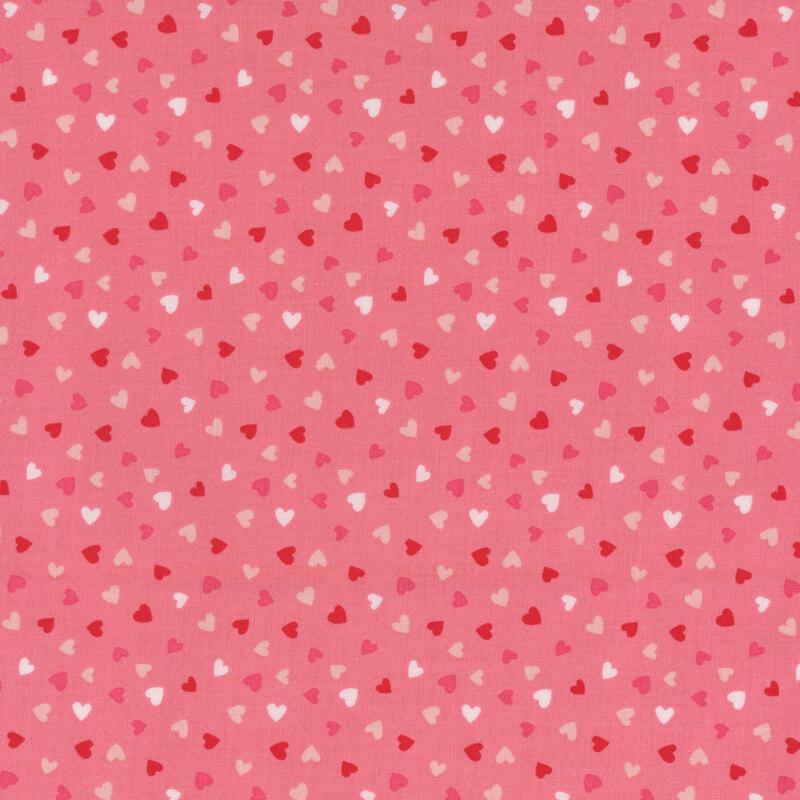 Light pink fabric with tiny red and white ditsy hearts throughout