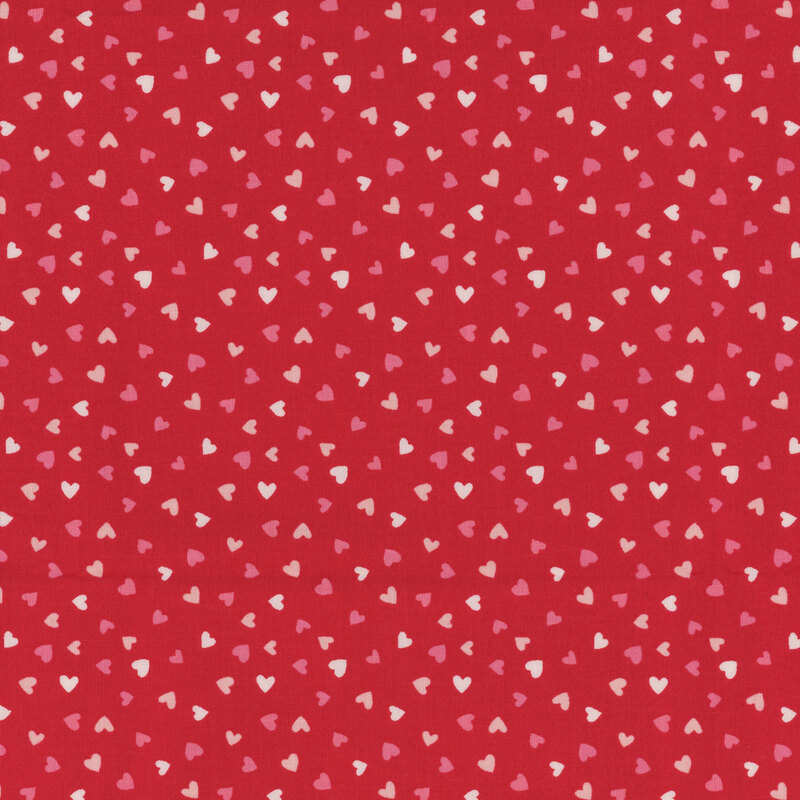 Bright red fabric with tiny red, white, and pink ditsy hearts all over