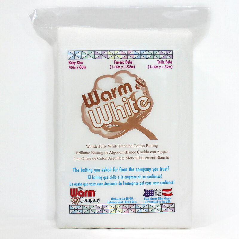 A package of Warm & White cotton batting, 45 x 60, with a colorful geometric border and branding.