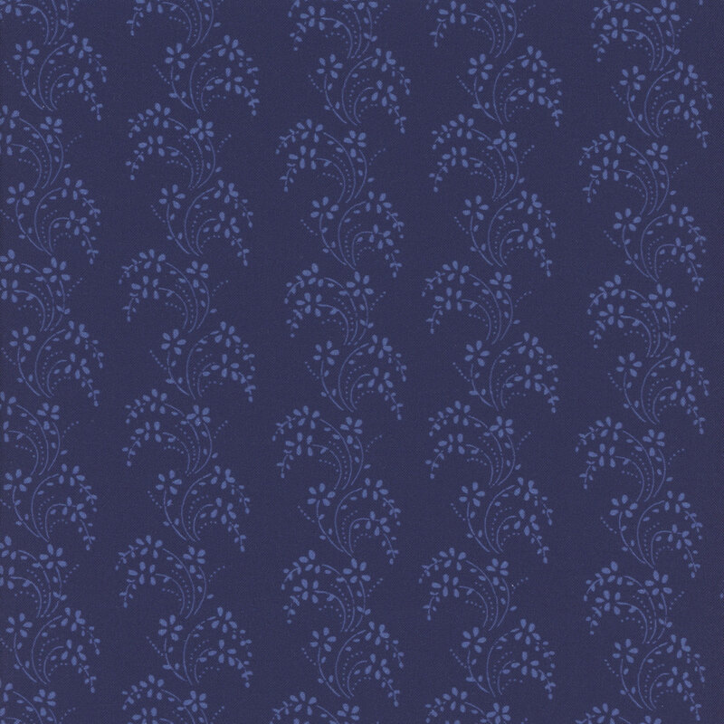 Navy blue fabric with columns of light blue wavy leaves and vines