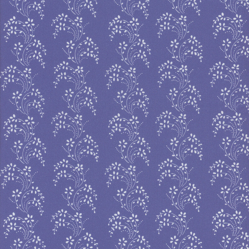 Medium blue fabric with columns of white, wavy leaves and vines