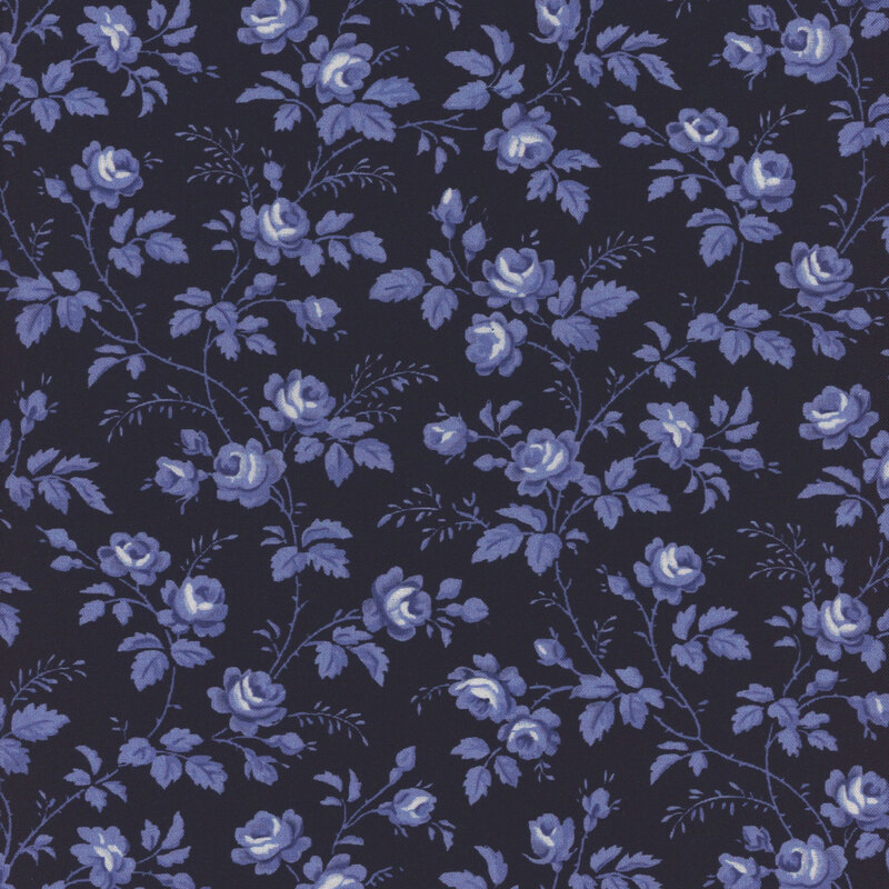 Navy blue fabric with light blue roses and vines all over