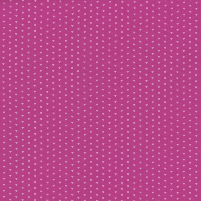 Magenta pink fabric with a pattern of mini light pink hearts