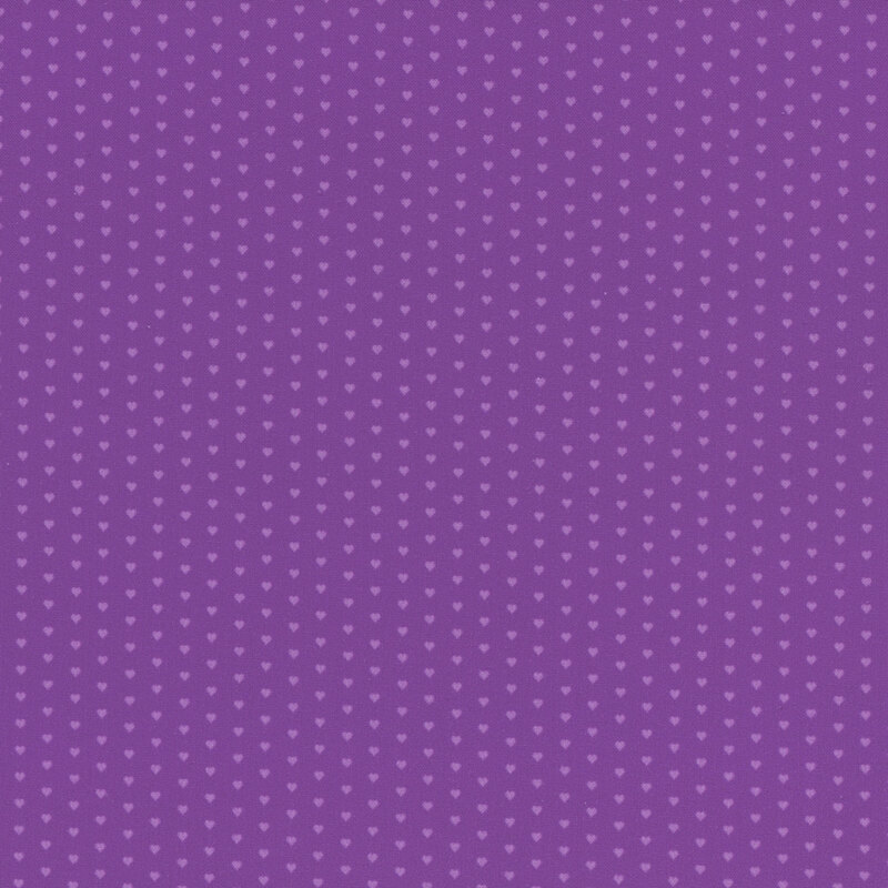 Purple fabric with a pattern of mini light purple hearts