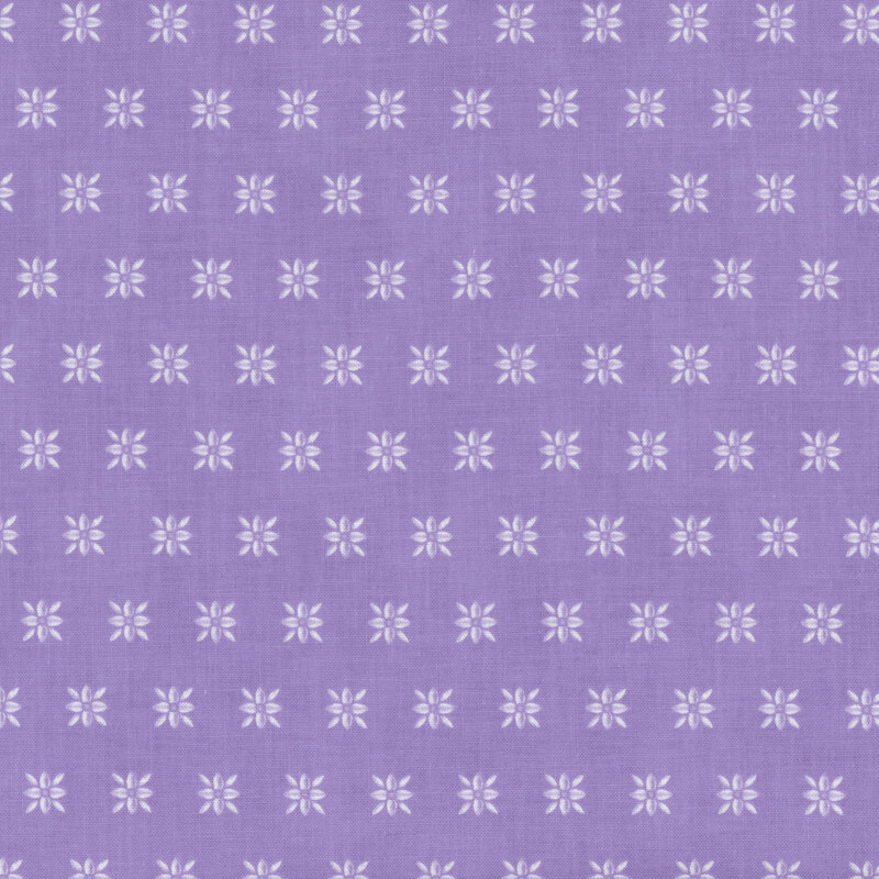 Light purple fabric with a repeating, white, ornamental floral design spaced evenly apart.