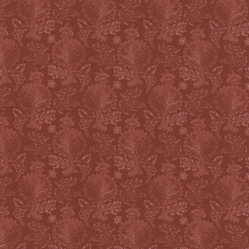 Tonal red fabric featuring florals and large intricate leaves