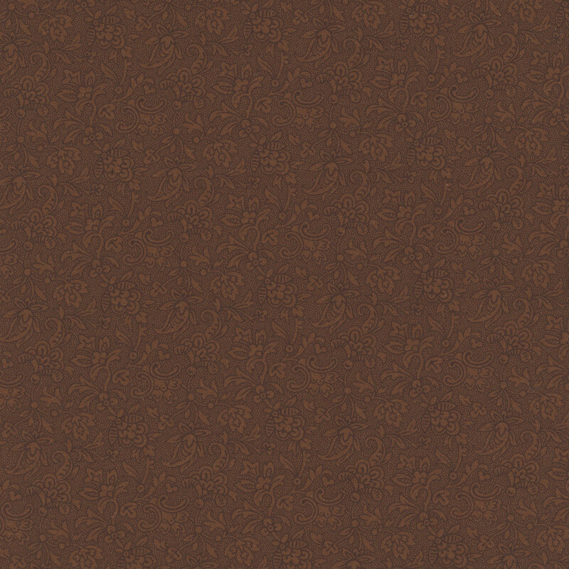 Tonal chocolate brown fabric with an intricate floral design