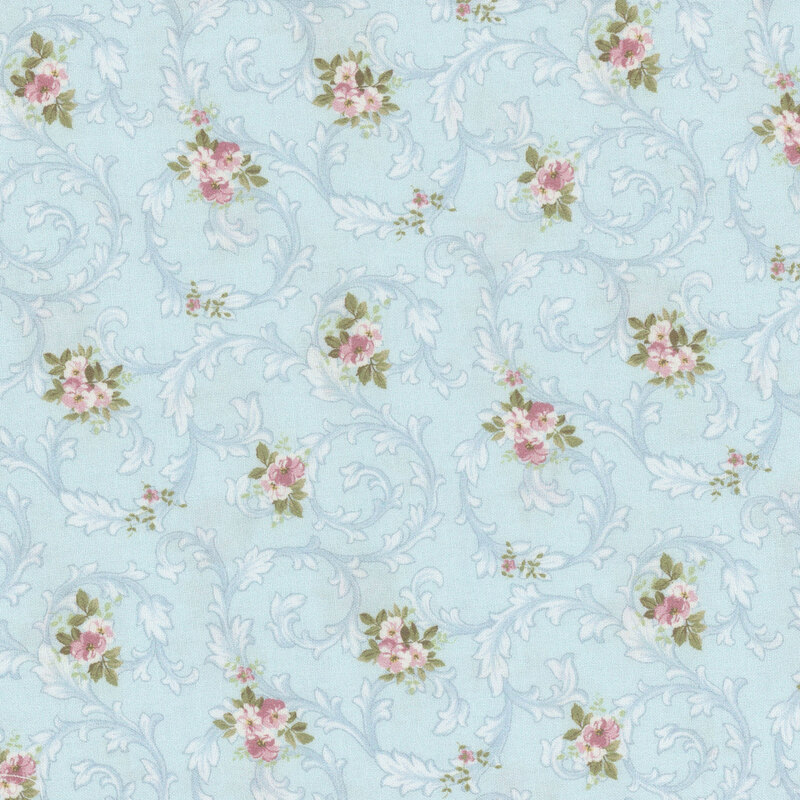 Sky blue fabric with swirling vine pattern and floral overlay