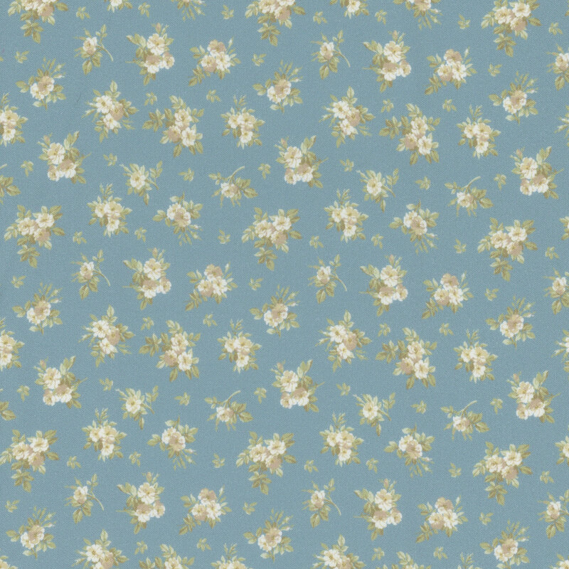 Light blue fabric with tiny white flowers and green leaves arranged in a repeating pattern.