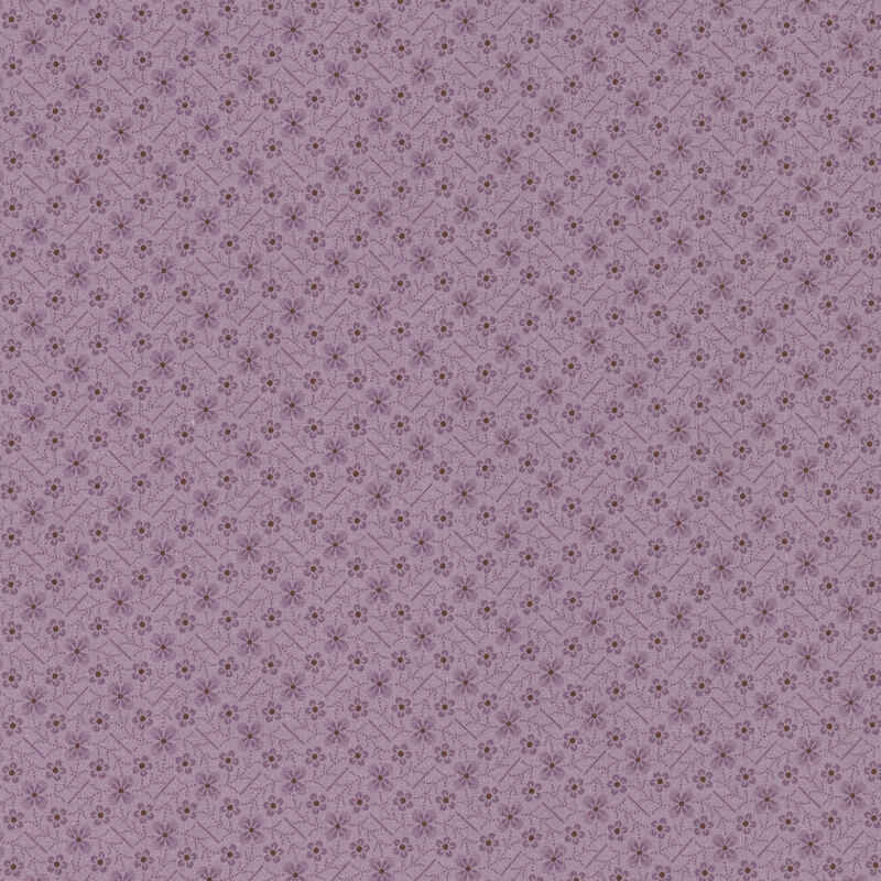 purple fabric with flowers and diagonal lines in a latticed zig-zag pattern