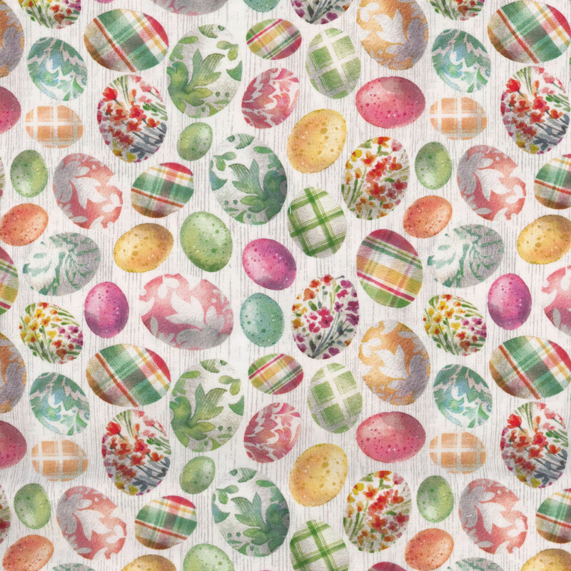 white fabric tossed with colorful easter eggs with plaid, floral, and decorative designs