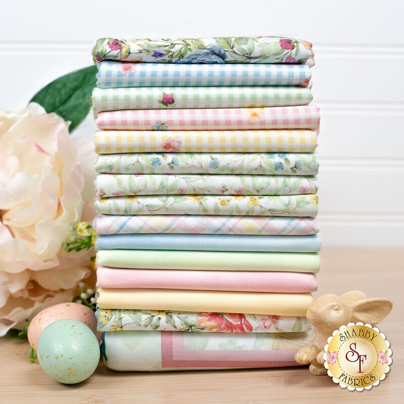 A stack of fabrics in bunnies and blooms FQ Set featuring florals and pastels