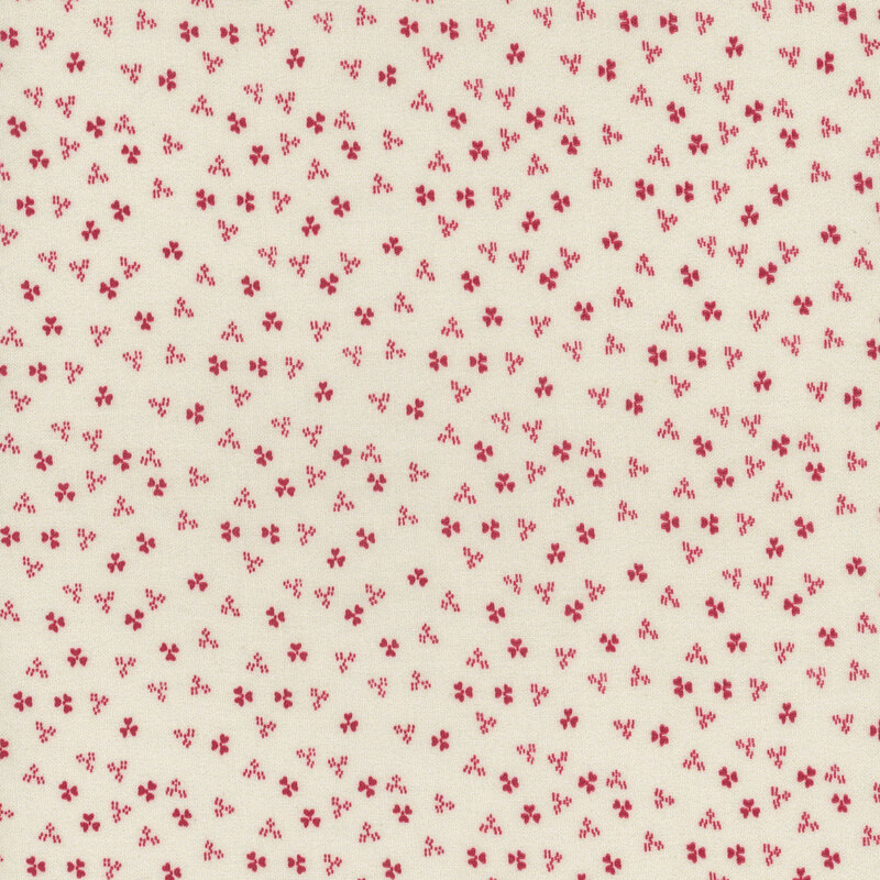 Cream fabric featuring small red florals 