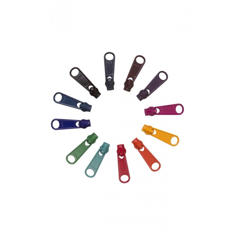 A circular arrangement of colorful fabric zipper pulls in various shades, including blue, green, purple, red, yellow, and orange.