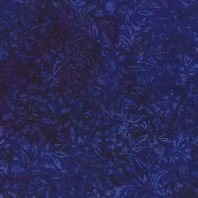 Dark blue batik fabric with mottled purple hints of floral outlines throughout