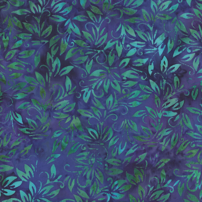 Mottled blue fabric with green leaves throughout