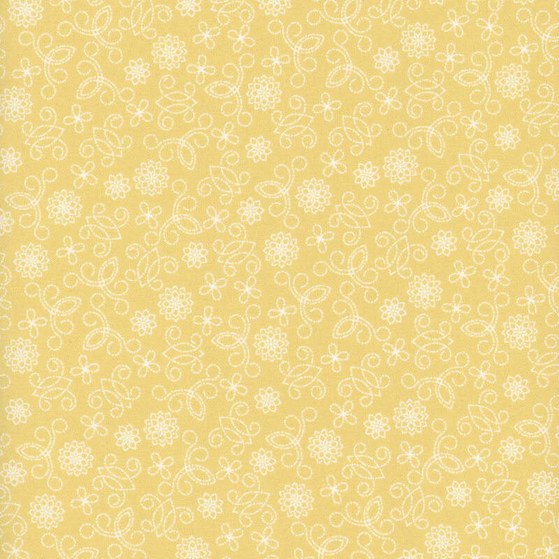 Light yellow fabric with white swirls and flowers.