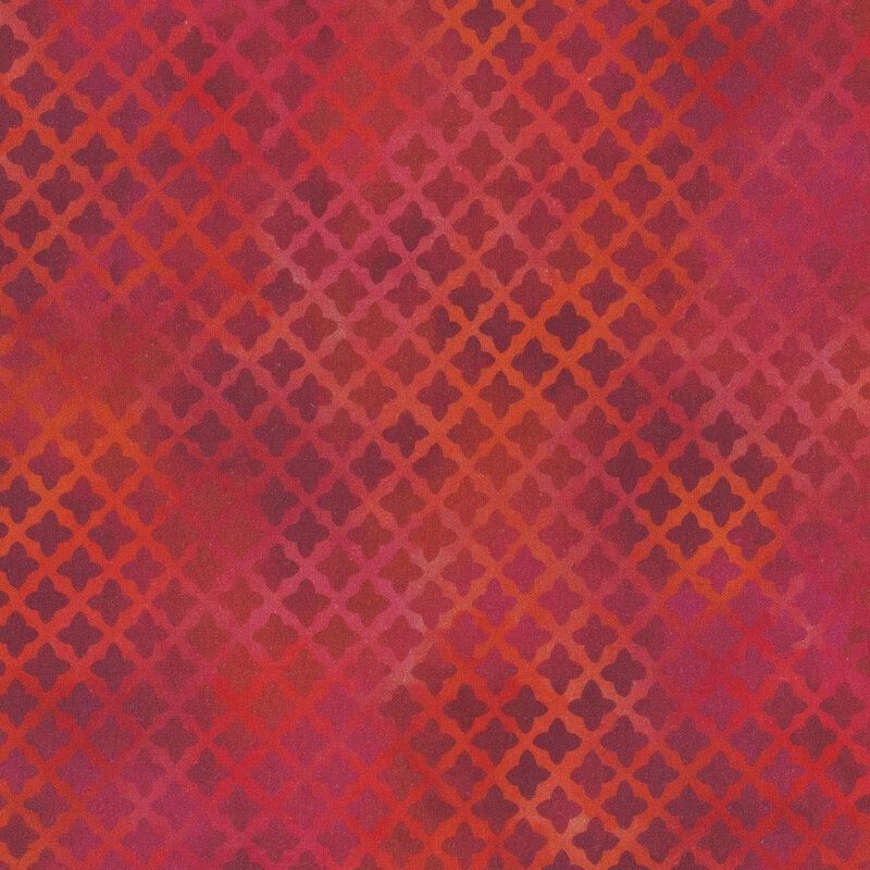 Mottled red fabric with a repeated lattice design.