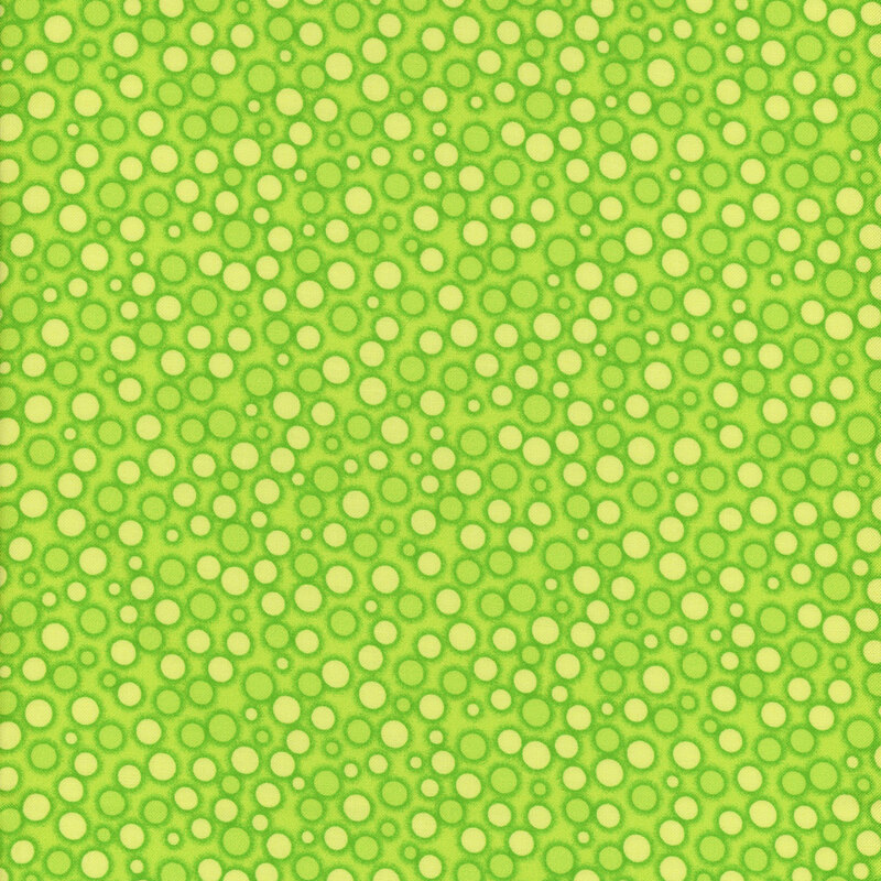 Bright lime green fabric packed with pale yellow spots