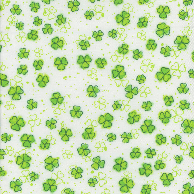 White fabric featuring bright green shamrocks 