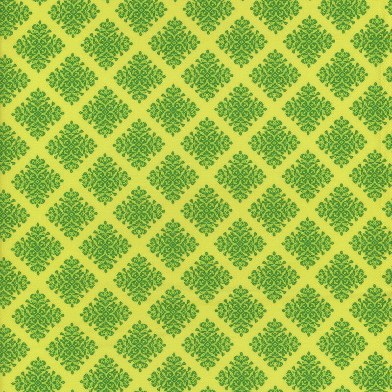 A repeating diamond pattern in green on a green fabric.