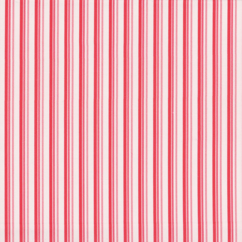 white fabric with thin pink and red alternating vertical stripes