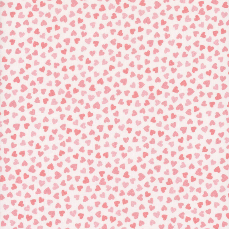 white fabric with soft shades of small scattered pink hearts