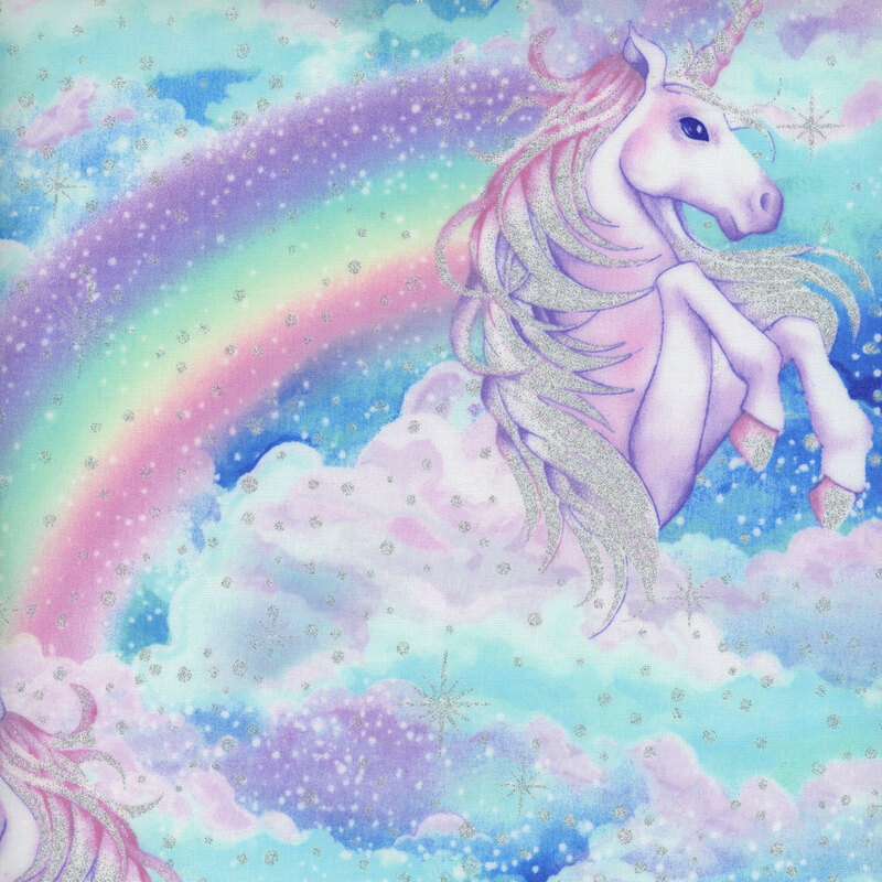 pastel blue fabric with mirrored rearing unicorns surrounded by clouds and rainbows with scattered sparkles and stars across the whole fabric