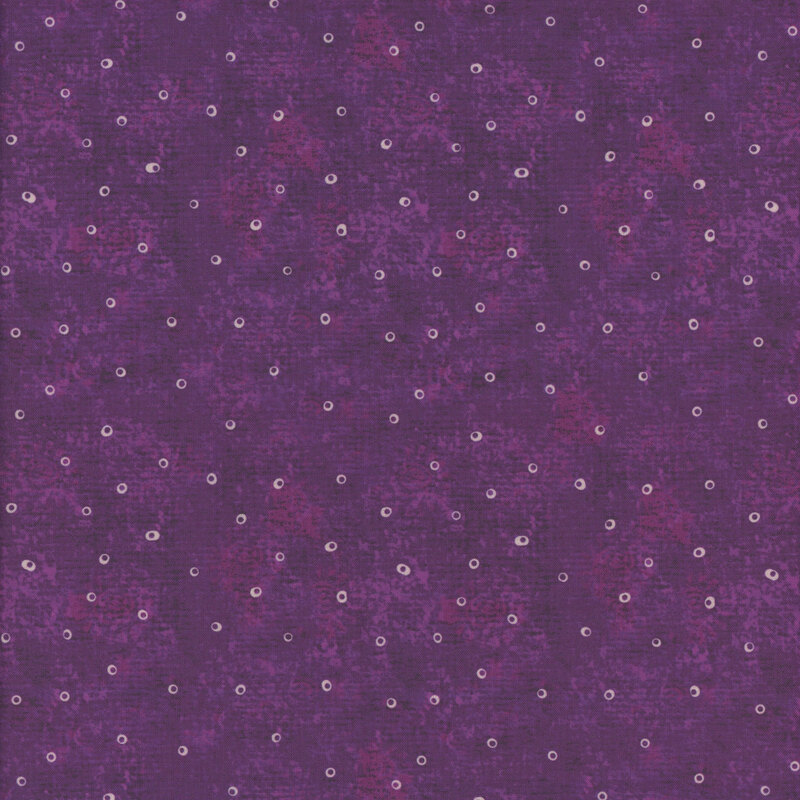 Purple mottled fabric with small white rings all over