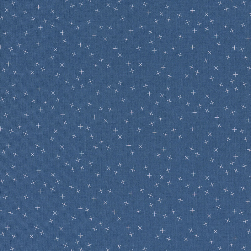 Medium blue fabric with small white X's scattered throughout