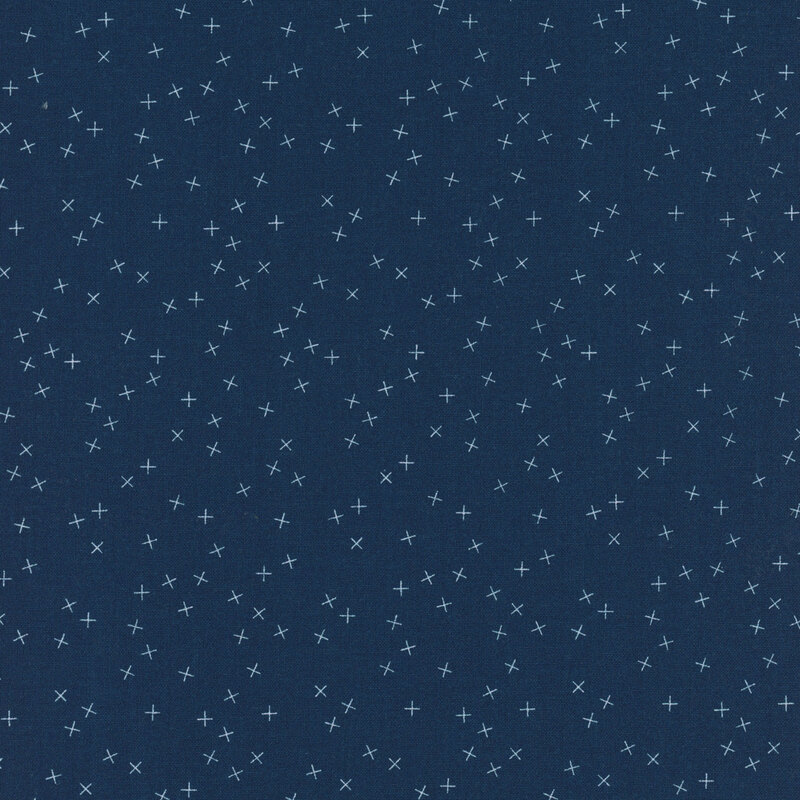 Navy blue fabric with small white X's scattered throughout