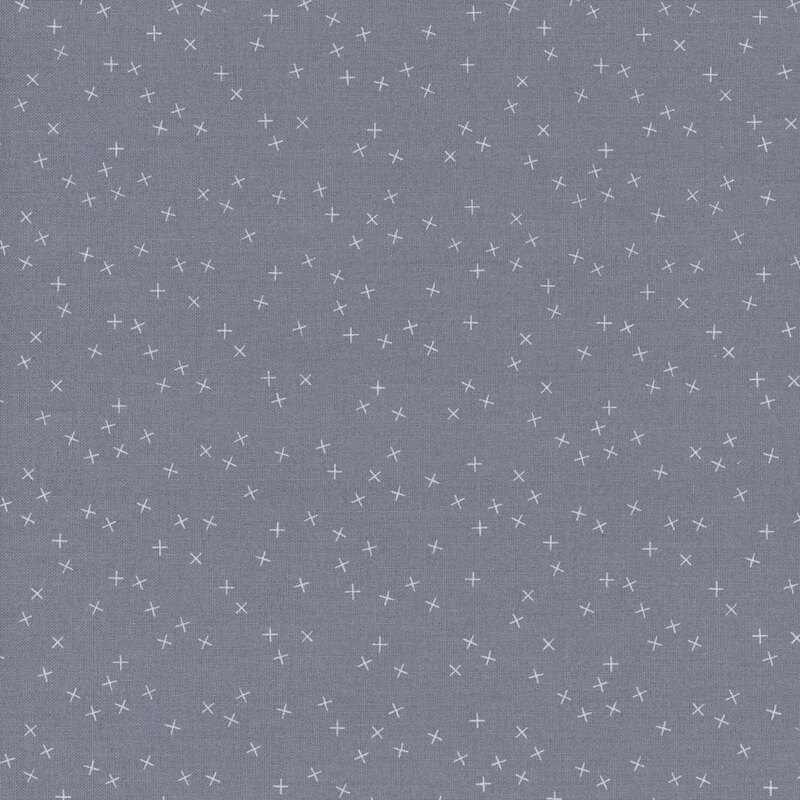 Gray fabric with small white X's scattered all over