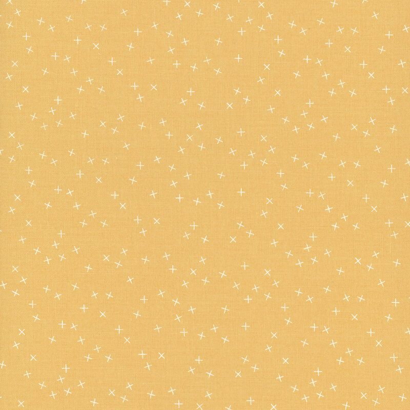 Yellow fabric with small white X's scattered throughout