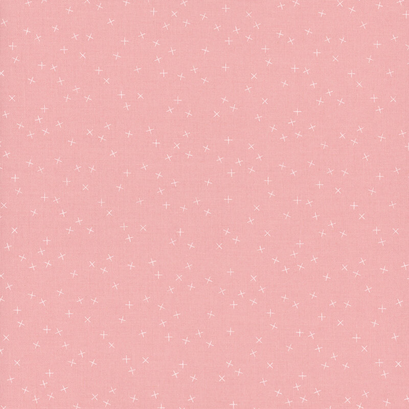 Light pink fabric with small white X's scattered throughout