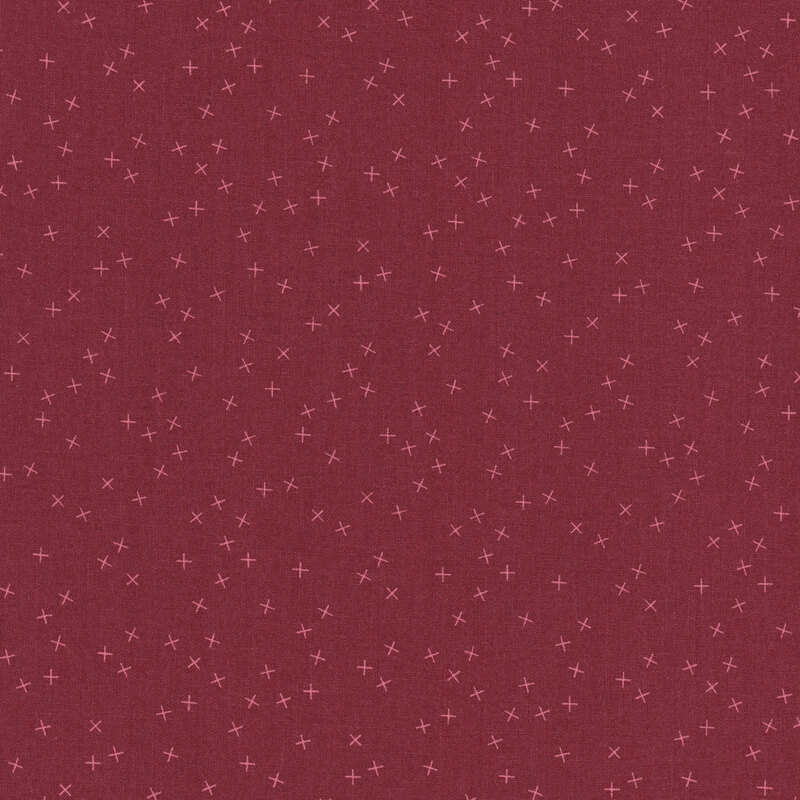 Burgundy fabric with tonal light red X's scattered all over