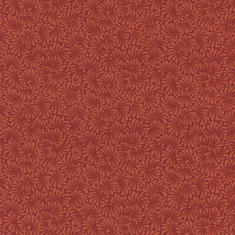 Tonal red fabric with a repeating intricate swirled pattern throughout