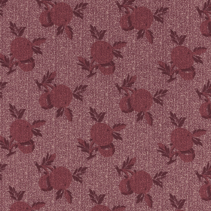 A wine colored fabric with large repeating berry patterns and a 