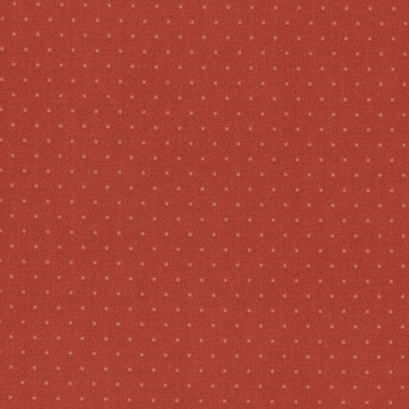 Brick red fabric with repeating small, burnt orange blocks throughout