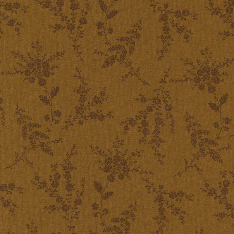 Golden brown fabric with dark brown vines and florals throughout