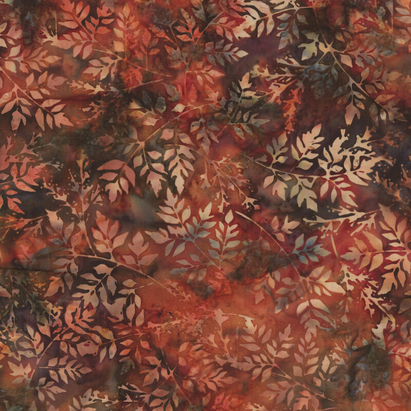 Burnt orange batik with a leaf pattern.