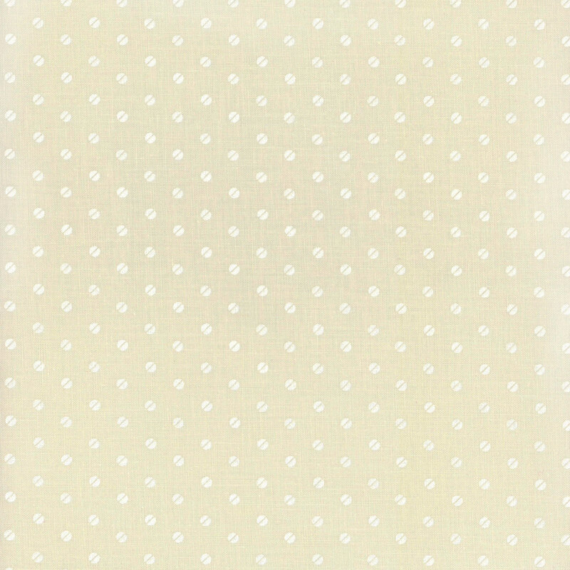 Light cream-colored fabric with small white polka dots evenly spaced throughout.