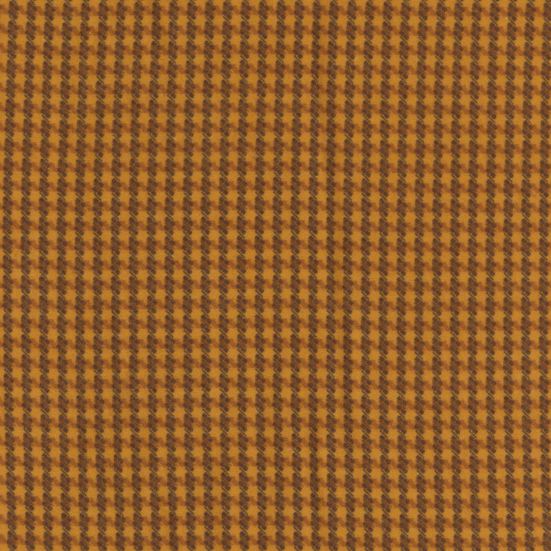 Burnt orange fabric with a geometric flannel pattern