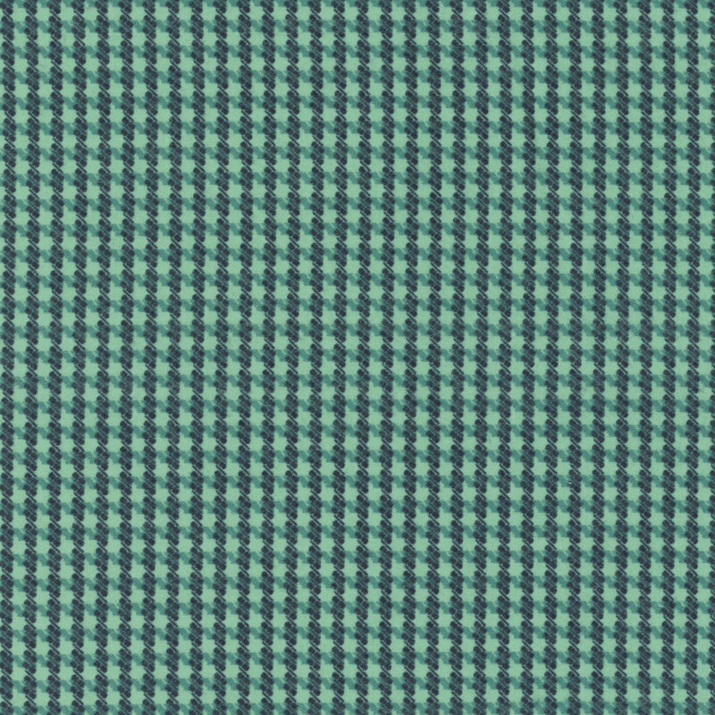 Teal flannel fabric with a gridded houndstooth pattern