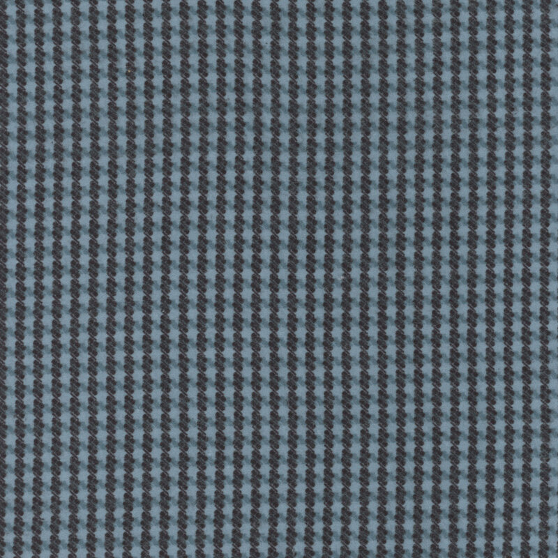 Blue flannel fabric with a black houndstooth pattern